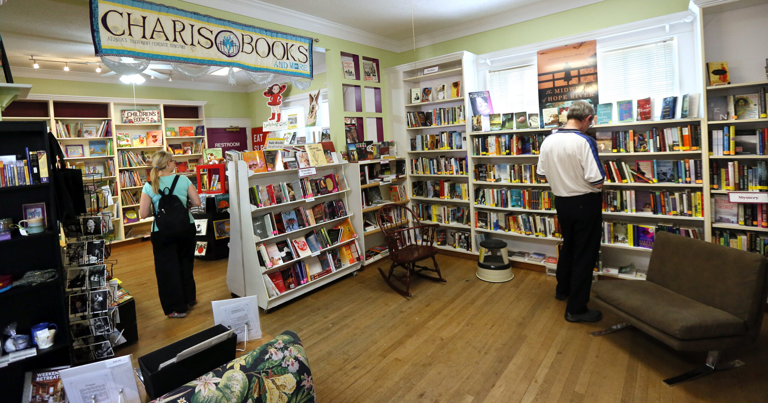 082713 Atlanta: Simone Puterman (left) and Franz Tomasek browse the book displays at Charis Books, one of the few independent operations that has survived Amazon's strength in the bookstore retail market, on Tuesday, August 27, 2013, in Atlanta. CURTIS COMPTON / CCOMPTON@AJC.COM